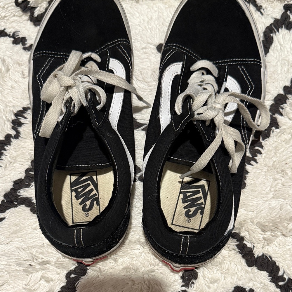 Vans women’s Classic Black and White Sneakers